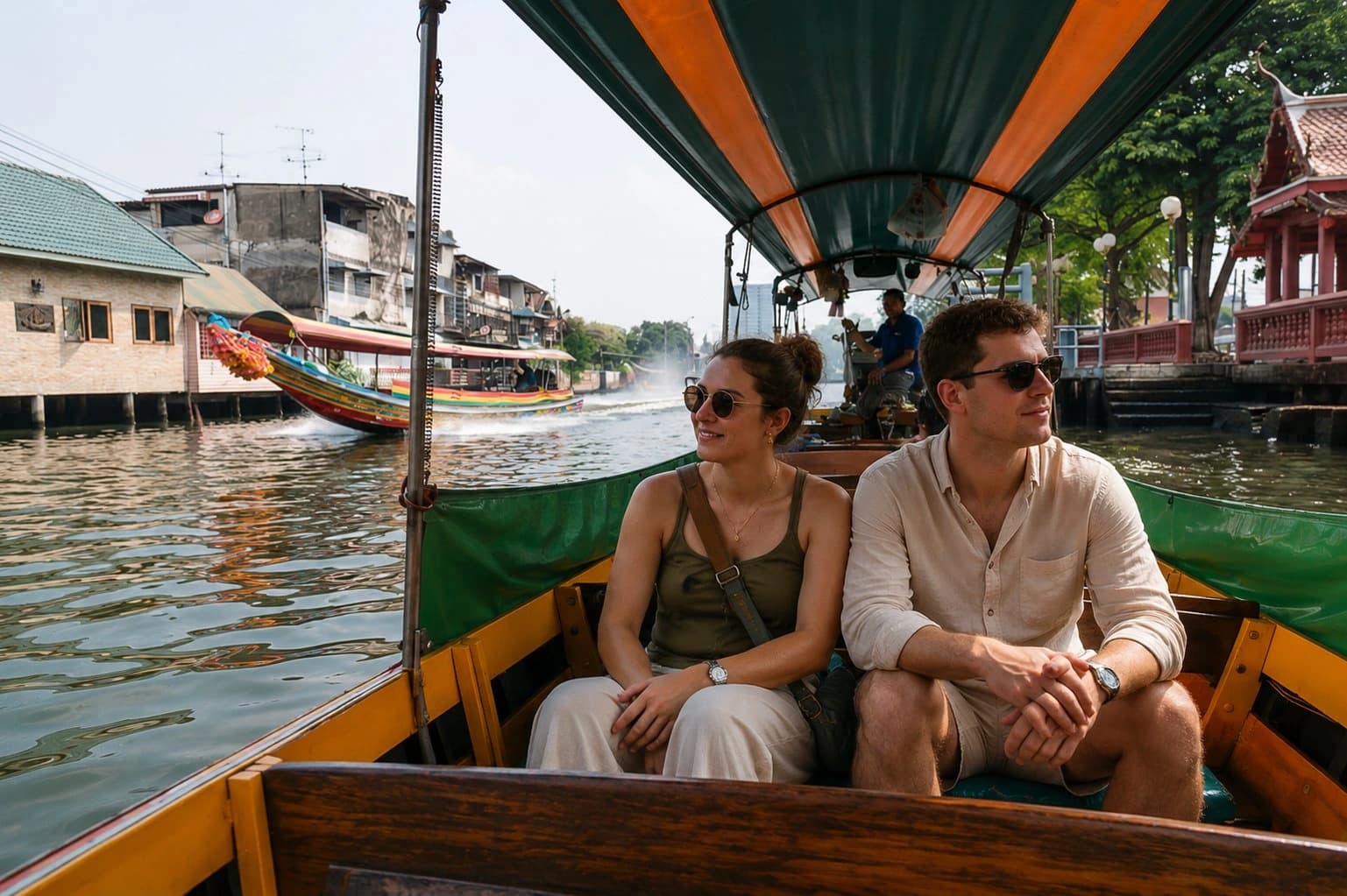 Passengers aboard the traditional teak boat on the Bangkok canal tour