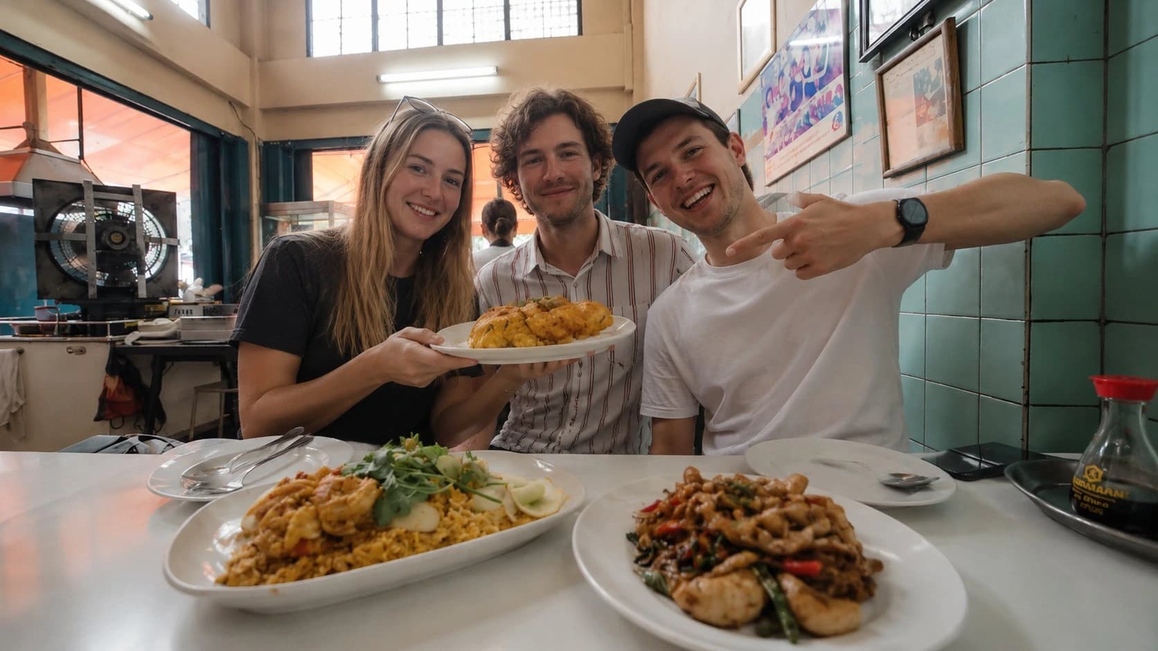 Guests eating together at a street food stall on a Bangkok tour